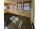 Sunroom features tile flooring and multiple windows at 209 N Watauga Ave, Dunn, NC 28334