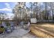 Backyard patio with seating area and storage shed at 235 N Fuquay Springs Ave, Fuquay Varina, NC 27526