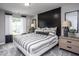 Bedroom with wood accent wall and striped bedding at 295 Broomside Ave, Raleigh, NC 27603