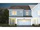 Two-story townhome with gray siding, white trim, and a two-car garage at 295 Broomside Ave, Raleigh, NC 27603