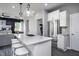 Modern kitchen with white cabinets, granite countertops, and stainless steel appliances at 295 Broomside Ave, Raleigh, NC 27603