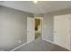 Simple bedroom with carpet, doors and hallway view at 311 Burnette St, Durham, NC 27707