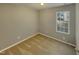 Small bedroom with gray walls, carpet, and one window at 311 Burnette St, Durham, NC 27707