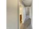 Hallway with gray walls, carpet, and a bathroom entrance at 311 Burnette St, Durham, NC 27707