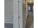 Long hallway with carpet and doors at 311 Burnette St, Durham, NC 27707