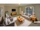 Virtually staged living room with modern furniture at 311 Burnette St, Durham, NC 27707