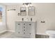 Modern bathroom with double vanity and updated fixtures at 311 Nc 56, Louisburg, NC 27549