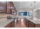 Open concept kitchen with stainless steel appliances and hardwood floors at 4616 Transept Ct, Holly Springs, NC 27540