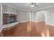 Spacious living room with hardwood floors and stone fireplace at 4616 Transept Ct, Holly Springs, NC 27540