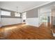 Bright dining room features hardwood floors, wainscoting, and kitchen access at 503 Bendemeer Ln, Rolesville, NC 27571