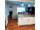 Spacious kitchen with granite island, stainless steel appliances, and hardwood floors at 503 Bendemeer Ln, Rolesville, NC 27571