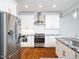 Modern kitchen boasts stainless steel appliances and white cabinetry at 503 Bendemeer Ln, Rolesville, NC 27571