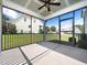 Relaxing screened porch with concrete flooring, offering backyard views at 503 Bendemeer Ln, Rolesville, NC 27571