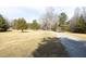 Gravel driveway leading to a house nestled in a wooded area at 540 Patterson Dr, Chapel Hill, NC 27516