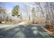Gravel driveway leading to a house in a wooded area at 540 Patterson Dr, Chapel Hill, NC 27516