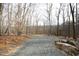 Gravel driveway leading into wooded area at 540 Patterson Dr, Chapel Hill, NC 27516