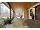 Covered front porch with stone flooring and a comfortable red chair at 540 Patterson Dr, Chapel Hill, NC 27516