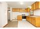 Efficient kitchen featuring light wood cabinets and tile floors at 540 Patterson Dr, Chapel Hill, NC 27516
