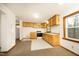 Simple kitchen with light wood cabinets and white appliances at 540 Patterson Dr, Chapel Hill, NC 27516