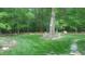 Landscaped yard with large tree and stone accents at 540 Patterson Dr, Chapel Hill, NC 27516