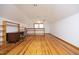 Large loft area with wood floors and built-in shelving at 540 Patterson Dr, Chapel Hill, NC 27516