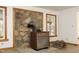 Stone fireplace with wood burning stove in living room at 540 Patterson Dr, Chapel Hill, NC 27516