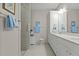 Elegant bathroom with a double vanity and large walk-in shower at 5503 Rutherford Close, Pittsboro, NC 27312