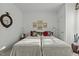 Bright bedroom with twin beds and decorative wall art at 5503 Rutherford Close, Pittsboro, NC 27312
