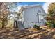 Gray sided house exterior with wooden stairs and deck at 5503 Rutherford Close, Pittsboro, NC 27312