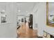 Hallway view of kitchen with hardwood floors at 5503 Rutherford Close, Pittsboro, NC 27312