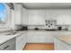 Modern white kitchen features granite countertops and ample cabinet space at 5503 Rutherford Close, Pittsboro, NC 27312