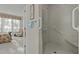 Walk-in shower with grab bars and bench seating at 5503 Rutherford Close, Pittsboro, NC 27312