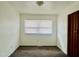 Spacious bedroom featuring neutral wall and carpet colors at 627 Quarry St, Raleigh, NC 27601