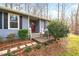 House exterior showcasing front entrance and landscaping at 6814 Lockwood Dr, Durham, NC 27712