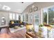 Sunroom with seating area and plenty of windows at 6814 Lockwood Dr, Durham, NC 27712