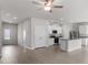 Open concept kitchen with island, stainless steel appliances, and light cabinets at 704 Rhino Bnd, Oxford, NC 27565