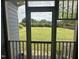 Screened porch overlooks a spacious backyard with lush green grass at 7513 Orchard Crest Ct, Apex, NC 27539