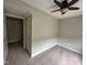 Well-lit bedroom with carpet and closet at 7513 Orchard Crest Ct, Apex, NC 27539