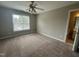 Bright bedroom with large window and carpet at 7513 Orchard Crest Ct, Apex, NC 27539