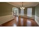 Formal dining room with hardwood floors and chandelier at 7513 Orchard Crest Ct, Apex, NC 27539