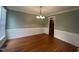 Formal dining room with hardwood floors and wainscoting at 7513 Orchard Crest Ct, Apex, NC 27539