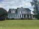 Two-story house with blue siding, black shutters, and a large front yard at 7513 Orchard Crest Ct, Apex, NC 27539