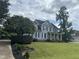 Two-story house with blue siding, black shutters, and a landscaped yard at 7513 Orchard Crest Ct, Apex, NC 27539