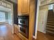 Built-in double oven and microwave in kitchen at 7513 Orchard Crest Ct, Apex, NC 27539