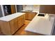 Large kitchen island with quartz countertops and ample storage at 7513 Orchard Crest Ct, Apex, NC 27539