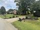 Residential street with manicured lawns and upscale homes at 7513 Orchard Crest Ct, Apex, NC 27539