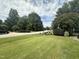 Residential street with lush landscaping and mature trees at 7513 Orchard Crest Ct, Apex, NC 27539