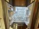Modern stainless steel refrigerator with ample storage space at 7513 Orchard Crest Ct, Apex, NC 27539