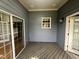 Another view of the screened porch with access to the interior at 7513 Orchard Crest Ct, Apex, NC 27539