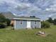 Detached shed with gray siding in backyard at 7513 Orchard Crest Ct, Apex, NC 27539